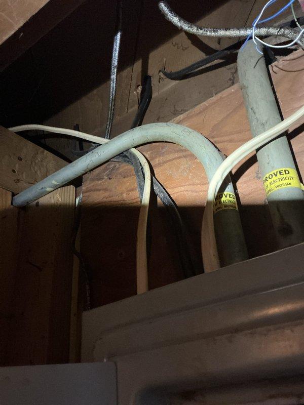 Conducted comprehensive equipment assessment at vacant 1953 ranch-style home totaling 1872 square feet to provide replacement estimate for aging furnace, central air conditioning system, and water heater, all identified as beyond expected service life by home inspector. Performed visual inspection of existing natural gas HVAC equipment and water heating system in basement utility area, documented electrical panel configuration and existing infrastructure, examined ductwork routing through attic space including flexible duct runs and piping penetrations, and photographed all relevant mechanical systems and structural considerations for proper equipment sizing and installation planning.