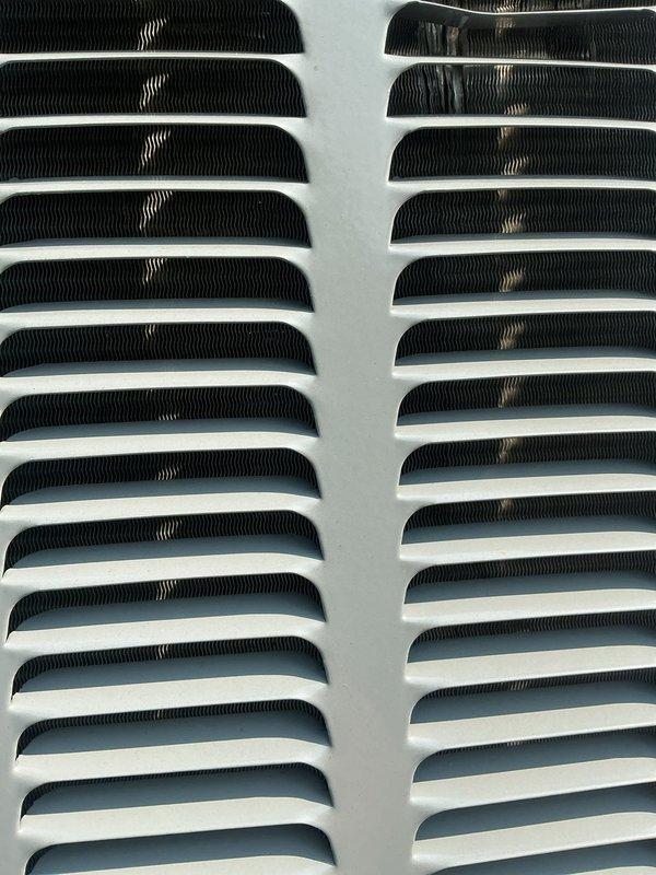 Completed annual cooling maintenance and inspection on residential HVAC system under EnergiAir warranty coverage. Performed comprehensive tune-up including inspection of evaporator coil fins, supply grilles, and air distribution components. System evaluated for proper airflow, refrigerant levels, and overall operational efficiency. Unit found to be operating within normal parameters. Documentation photos captured for service records.