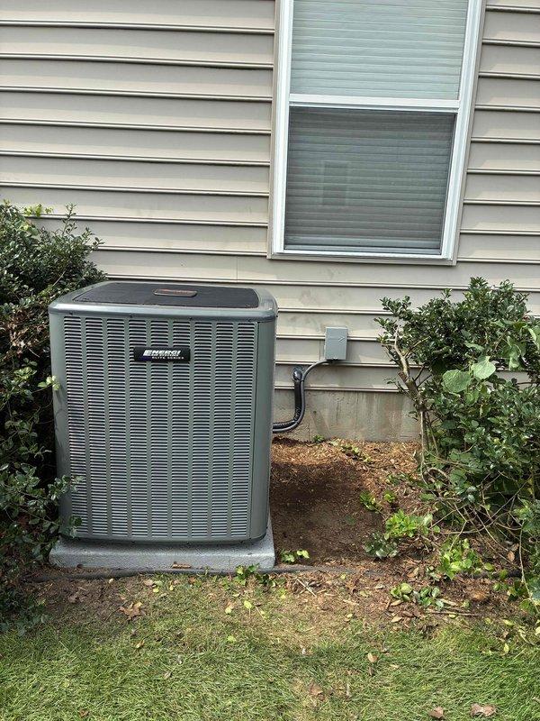 Completed full HVAC system installation including new furnace unit in basement utility area and outdoor air conditioning condenser unit. Installed furnace with proper PVC venting and ductwork connections, positioned adjacent to existing water heater with adequate service clearances maintained. Mounted exterior AC unit on concrete pad with refrigerant lines and electrical conduit properly routed along foundation, verified all connections, and tested system operation for proper heating and cooling functionality.