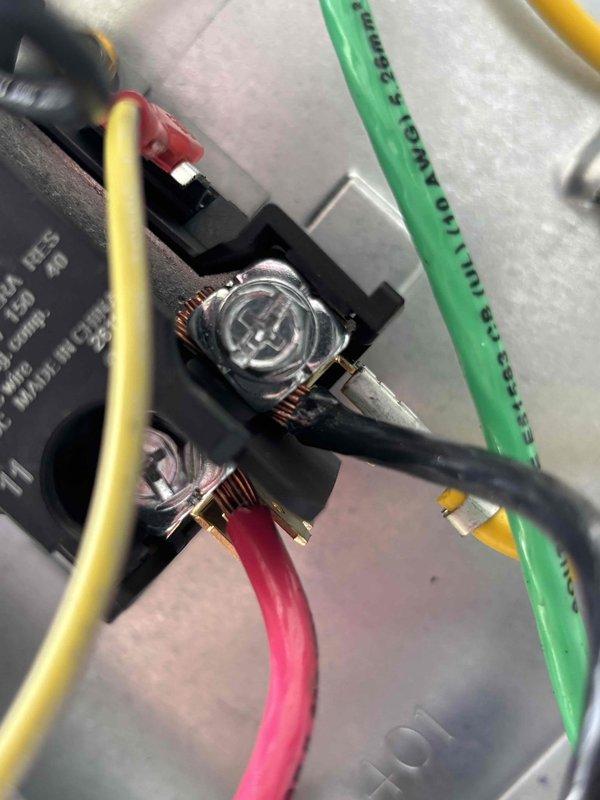 # No Cool Service Call - Carrier AC Unit

Responded to service call for air conditioning system with non-operational outdoor fan motor. Upon arrival, performed diagnostic evaluation of 0-year-old Carrier unit. Inspection revealed failed run capacitor preventing condenser fan motor operation while compressor attempted to run.

Accessed electrical compartment and tested capacitor with multimeter, confirming complete capacitor failure with no measurable capacitance. Disconnected power and safely discharged residual voltage from failed component. Removed defective dual run capacitor from mounting bracket and terminal connections.

Installed new OEM-equivalent dual run capacitor with proper microfarad and voltage ratings for unit specifications. Connected all electrical terminals according to wiring diagram: HERM terminal to compressor, FAN terminal to condenser fan motor, and COM terminal to common line. Verified all wire connections were secure with appropriate torque on terminal screws.
