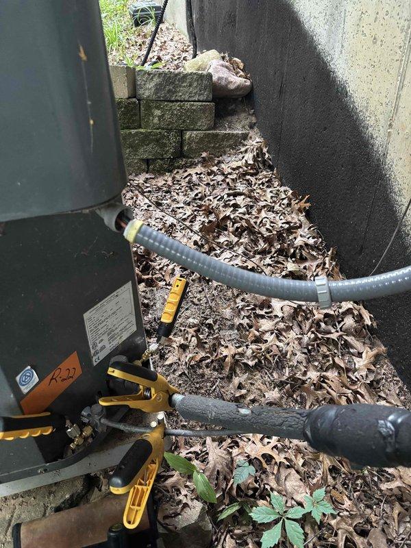 Completed annual cooling maintenance on 2019 Goodman outdoor condensing unit. Performed comprehensive system inspection including refrigerant pressure testing with manifold gauges, visual inspection of exterior cabinet and component labels, and internal ductwork examination using borescope camera to assess airflow pathway condition. Verified best contact number on file. All components operating within normal parameters, no deficiencies noted during inspection.