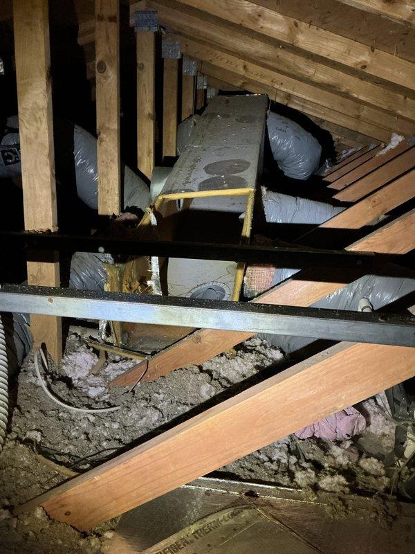 Conducted comprehensive site assessment for complete central air conditioning system installation at single-family residence. Previous compressor unit had been removed due to refrigerant leakage and mechanical failures. Evaluated existing ductwork infrastructure in attic space, confirming flexible insulated supply ducts and structural framework remain intact and suitable for new equipment integration. Inspected exterior location adjacent to home foundation for optimal condenser unit placement, noting adequate clearance and accessibility. Documented all mechanical systems, ductwork routing, and installation requirements through photographic survey to develop accurate equipment specifications and installation proposal.