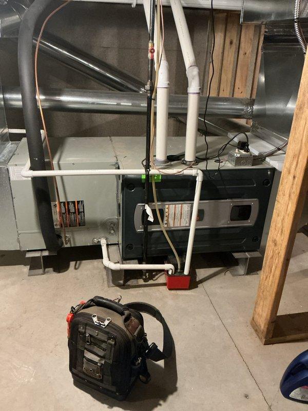 # CP-Cooling Problem Resolution

Responded to a no-cooling complaint on a 9-year-old Ingersoll Rand air conditioning system (Model: JTXCC060G05JHCAA, manufactured February 2019). Upon arrival, accessed the air handler unit in the basement mechanical room to diagnose the cooling failure. Performed visual inspection of the internal components with access panel removed, examining the evaporator coil, blower assembly, and refrigerant lines. Verified proper condensate drainage through the white PVC piping system and checked the condensate pump operation. Inspected the R-410A refrigerant lines for leaks or damage, including the copper suction line routing. Evaluated airflow through the ductwork system and confirmed electrical connections to the unit. System was restored to proper cooling operation following diagnostic procedures and necessary repairs.
