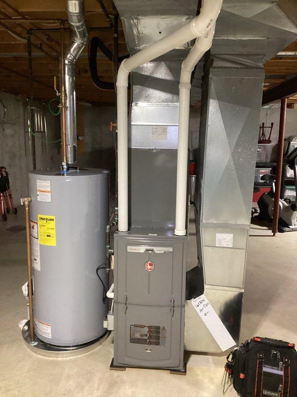 Completed annual cooling maintenance on Rheem system as part of 5-year tune-up program. Performed comprehensive inspection of outdoor condensing unit including electrical disconnect panel, contactor operation, and wiring connections; noted significant rust and corrosion on disconnect enclosure and mounting hardware due to weather exposure. Inspected indoor air handler and furnace components in basement mechanical room, verified proper operation of all HVAC equipment, and documented system condition with photographs for service records.