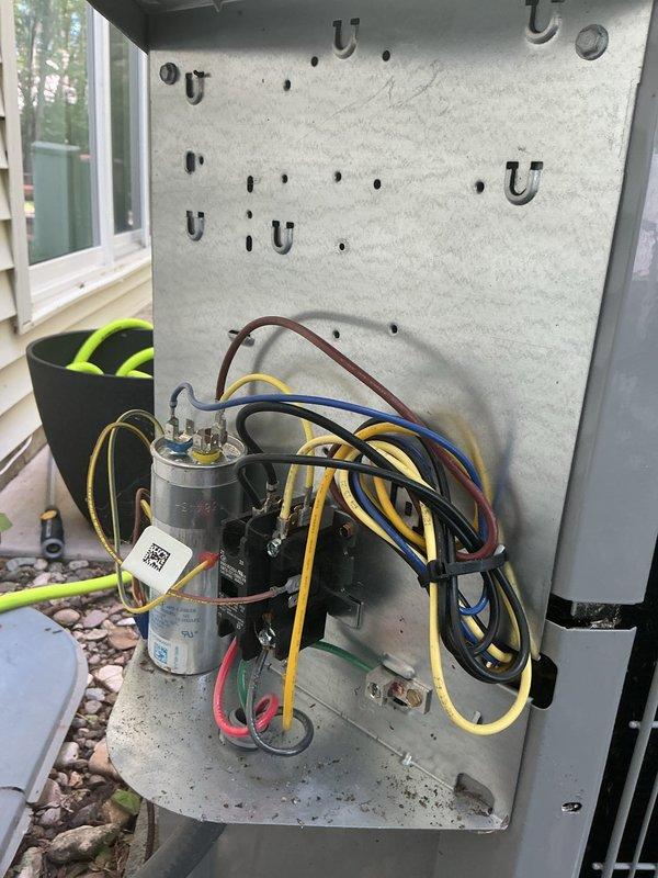 Completed annual cooling maintenance on 8-month-old Carrier system. Performed comprehensive system inspection including indoor and outdoor units. Inspected and photographed condensate pump assembly in basement, verifying proper operation and drainage function. Accessed outdoor condenser unit, removed service panel to inspect electrical components including capacitor, contactors, and associated wiring connections. All electrical connections found secure with proper color-coded wiring intact. Verified capacitor specifications and operational status. System operating within normal parameters with no deficiencies noted at time of service.