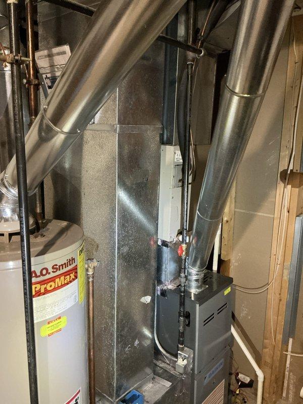 Performed sales estimate for HVAC system replacement on 16-year-old air conditioning unit. Documented existing equipment configuration including furnace, ductwork, and A.O. Smith ProMax water heater in mechanical room. Provided replacement options and available promotional offers to customer for consideration.