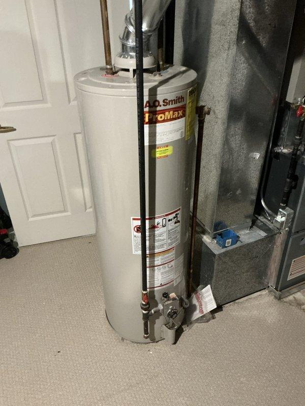 Performed sales estimate for HVAC system replacement on 16-year-old air conditioning unit. Documented existing equipment configuration including furnace, ductwork, and A.O. Smith ProMax water heater in mechanical room. Provided replacement options and available promotional offers to customer for consideration.