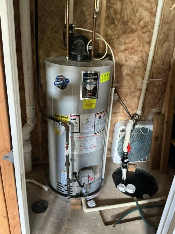 Performed comprehensive inspection and evaluation of existing 2016 Bradford White 50-gallon power-vent natural gas water heater to assess current condition and operational status. Unit showing no reported symptoms or issues at time of visit. Documented installation configuration including power-vent assembly, gas connections, plumbing connections, and surrounding utility area conditions through photographic documentation. Provided detailed consultation regarding replacement options, presenting specifications and efficiency comparisons between high-efficiency 50-gallon natural gas units and 50-gallon heat-pump hybrid electric models. Reviewed available utility rebate programs through Consumers Energy and Lansing Board of Water and Light for qualifying high-efficiency and heat-pump water heater installations. Discussed coordination of separate faucet installation work to be scheduled during future replacement visit. Prepared comprehensive estimate with equipment options and installation 
