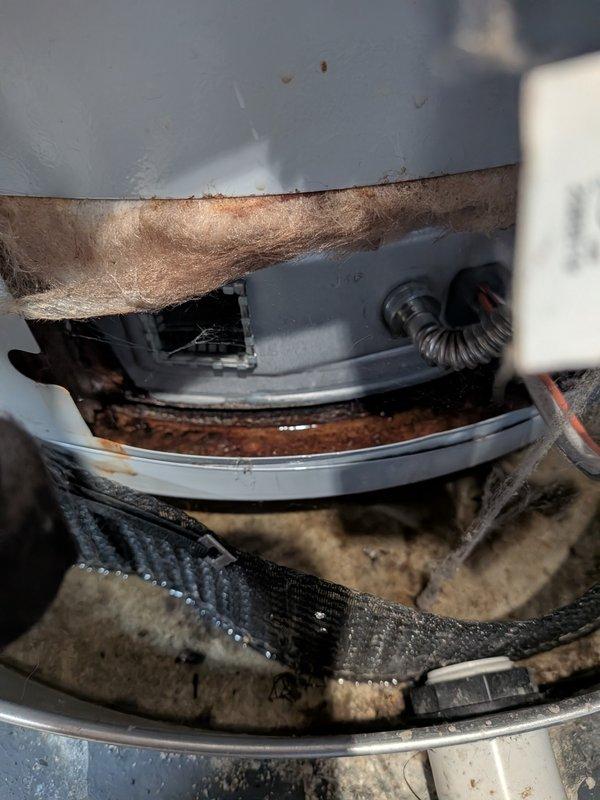 # CP-Cooling Problem Resolution

Responded to service call for air conditioning unit leaking water into basement causing standing water accumulation on 9-year-old system. Upon inspection, discovered severely clogged evaporator coil and drain pan with excessive debris, dust, and deteriorated filter material throughout the indoor air handler unit. The primary condensate drain line was completely obstructed, preventing proper drainage and causing water to overflow into the basement area.

Cleared the condensate drain line blockage and removed accumulated debris from the drain pan. Cleaned evaporator coil surfaces and surrounding components to restore proper airflow and drainage function. Inspected the condensate pump and verified proper operation. Checked all drain line connections and fittings for secure attachment and proper slope to prevent future backup issues.

Replaced deteriorated air filter and removed fibrous insulation material that had broken down within the unit. Addressed vis