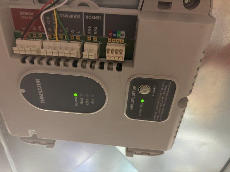 Responded to no-cool call on newly installed AC unit. Upon arrival, inspected indoor air handler and verified proper power supply to inverter control board with green LED indicator illuminated. Confirmed all low-voltage wiring connections were secure at terminal strip, including sensor and equipment communication wires. Checked wireless thermostat interface showing connected status with active power LED. Verified supply and return ductwork connections were properly sealed and airflow pathway was unobstructed through louvered grille assembly. System successfully commissioned and cooling operation restored.