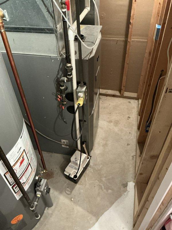 Conducted sales estimate for complete furnace and air conditioning system replacement in residential basement utility space. Assessed existing HVAC equipment configuration, including current furnace unit with associated ductwork, water heater placement, and mechanical room layout to determine optimal equipment sizing and installation requirements for proposed high-efficiency heating and cooling system upgrade.