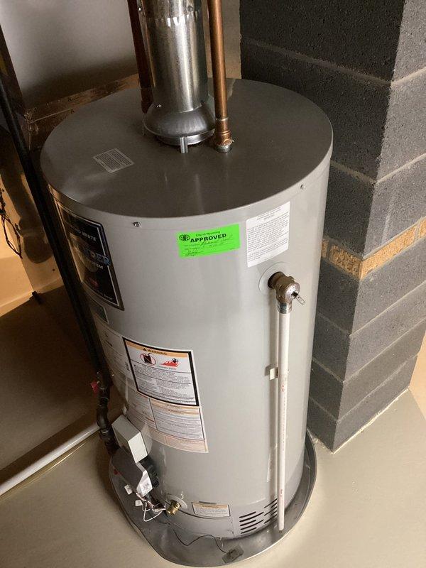 Responded to service call for noise coming from residential water heater. Upon arrival, inspected 8-year-old unit and confirmed water heater was still producing hot water and functioning properly. Performed visual inspection of tank, connections, and all plumbing components. Checked temperature and pressure relief valve, copper supply lines, and flue venting system for proper operation. Documented current condition of unit with photos showing standard residential installation with proper venting and safety components in place. Unit continues to heat water effectively despite noise complaint.
