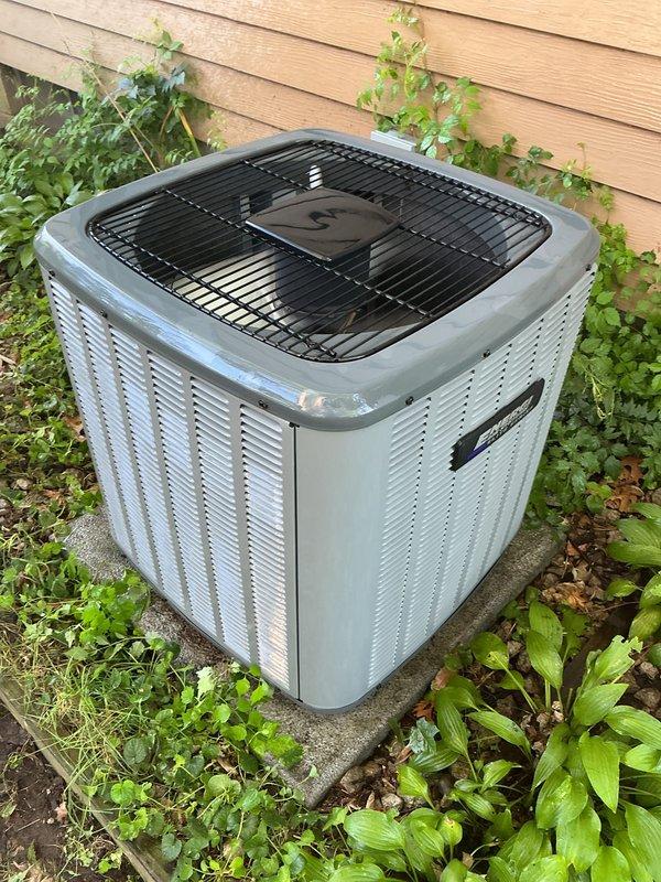 Completed annual heating maintenance on EnergiAir system with warranty coverage through October 2027. Performed comprehensive inspection of heating equipment, including drain pan examination showing normal condensate residue and proper drainage function. Verified outdoor condensing unit operation with clean coils and adequate airflow through louvered panels, noting appropriate clearance from surrounding vegetation. All system components functioning within normal parameters with humidifier operational as equipped.