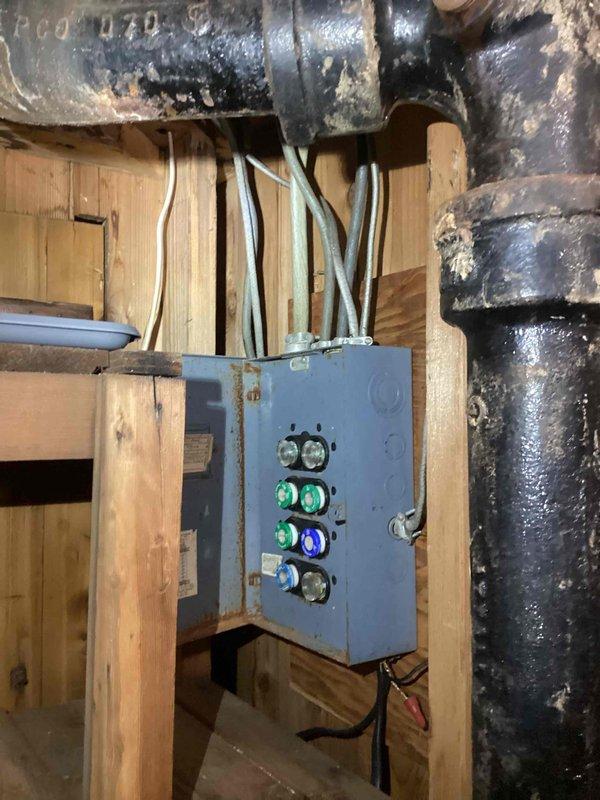 Conducted comprehensive in-home estimate for complete HVAC system replacement including 16-year-old furnace and central air conditioning unit. Evaluated existing electrical infrastructure, documenting current fuse panel configuration and assessing feasibility of upgrading to modern circuit breaker panel to support new furnace installation requirements. Photographed existing electrical panel showing multiple circuit breakers, main service connections, and associated wiring, as well as control systems and aged cast iron piping in basement utility area to determine compatibility with proposed equipment upgrades.