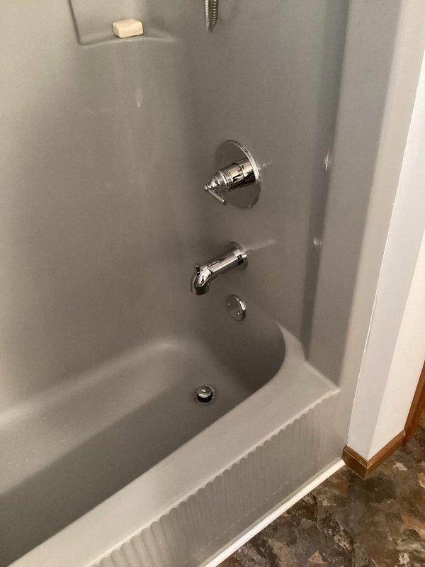 Completed installation of customer-supplied plumbing fixtures in bathroom, including two chrome faucets for double-sink vanity and shower valve with cover plate for tub/shower combination. All fixtures installed to code specifications with proper water supply connections, tested for leaks, and confirmed full operational functionality upon completion.
