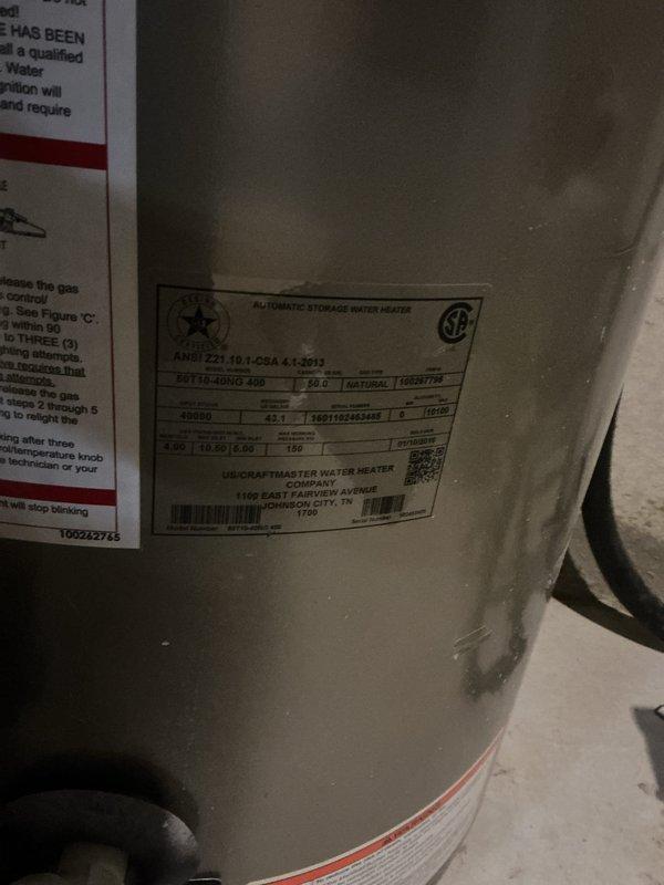 Performed estimate for water heater replacement on existing 10-year-old Whirlpool unit manufactured by U.S. Craftmaster Water Heater Company. Documented current automatic storage water heater condition and specifications, photographed manufacturer data plate showing ANSI Z21.10.1-2013/CSA 4.1-2013 certification, and assessed installation location in basement utility area. Customer seeking replacement options with availability for early installation scheduling.