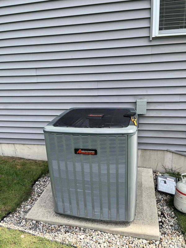Completed full HVAC system installation including new furnace and air conditioning unit. Installed Amana outdoor condenser on concrete pad with proper clearances, connected refrigerant lines and electrical conduit to exterior wall. Interior installation included new furnace with blower assembly in basement mechanical room, integrated with existing ductwork and ventilation systems. Verified all electrical connections, tested system operation, and confirmed proper airflow throughout. System commissioned and left in full operational status.