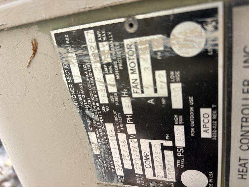 Responded to no cooling call with reported burning, sparkler-like smell that occurred suddenly throughout home while AC system was running. Upon arrival, found older AC unit had been shut off by homeowner as a safety precaution. Inspected system components and documented equipment nameplate information to assess unit age and specifications for diagnostic purposes.