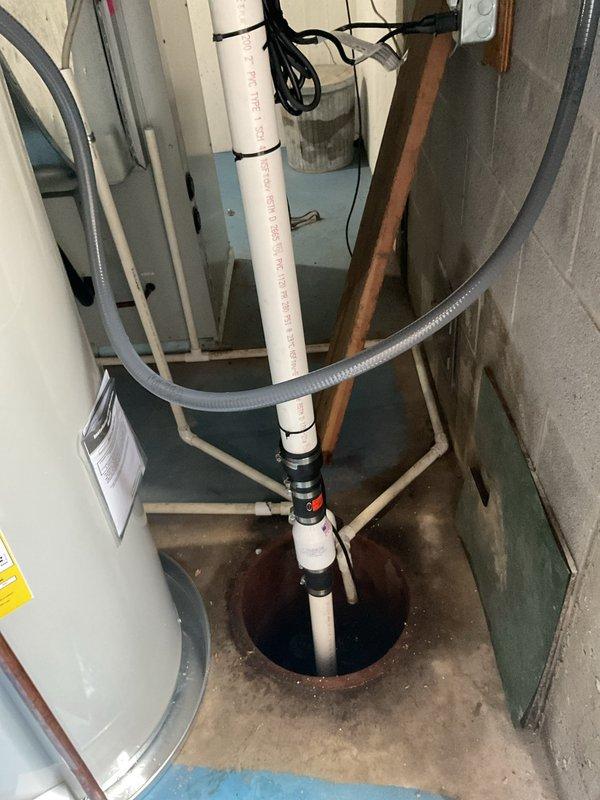 Successfully installed a 50-gallon electric water heater in the basement utility area, complete with proper electrical connections and plumbing integration. Installed a new sump pump system with PVC discharge piping and flexible hose routing to manage groundwater effectively. Added an expansion tank to the water heater system to protect against thermal expansion and maintain proper system pressure, ensuring all components meet current plumbing code requirements.