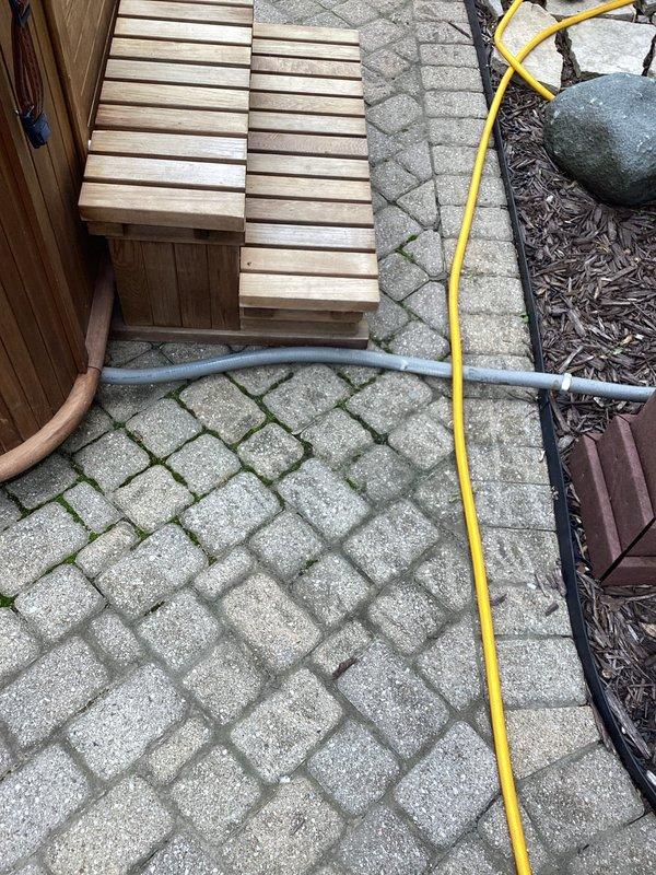 Completed electrical estimate for hot tub installation at residential property. Assessed existing electrical service and meter location on exterior wall, evaluated patio area with herringbone paver pattern where hot tub will be positioned, and documented current electrical infrastructure including main meter and conduit routing. Provided comprehensive estimate for new dedicated electrical circuit, appropriate GFCI protection, conduit run from main panel to hot tub location, and all materials and labor required to meet NEC code requirements for hot tub installations.
