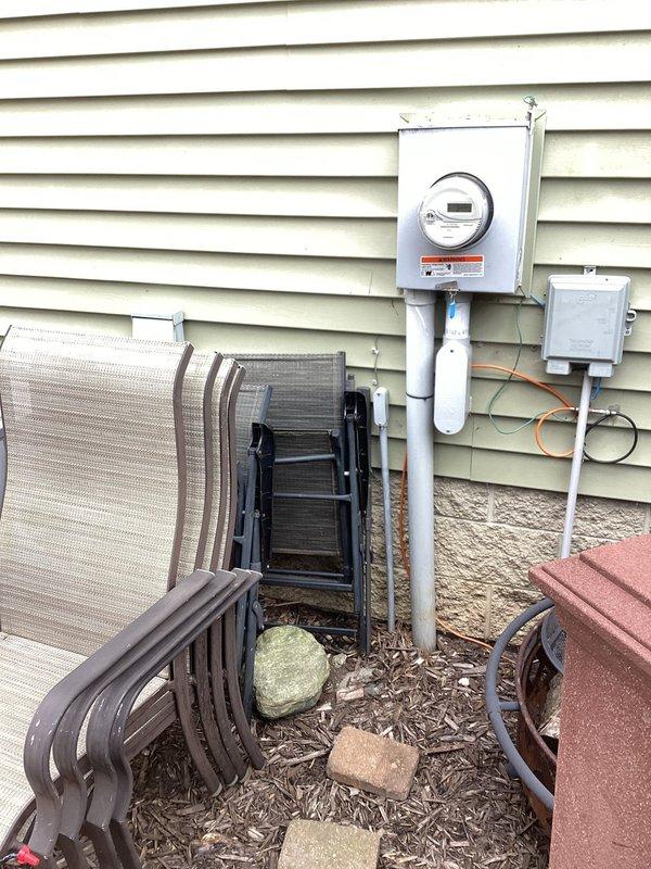 Completed electrical estimate for hot tub installation at residential property. Assessed existing electrical service and meter location on exterior wall, evaluated patio area with herringbone paver pattern where hot tub will be positioned, and documented current electrical infrastructure including main meter and conduit routing. Provided comprehensive estimate for new dedicated electrical circuit, appropriate GFCI protection, conduit run from main panel to hot tub location, and all materials and labor required to meet NEC code requirements for hot tub installations.