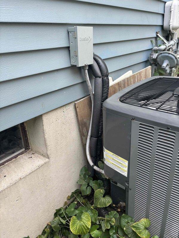 Completed annual cooling maintenance on EnergiAir air conditioning system. Performed comprehensive tune-up including inspection of outdoor condenser unit, electrical connections, and refrigerant lines. Verified proper operation of disconnect box, examined wiring connections within unit access panel, and confirmed secure mounting of all components including conduit and refrigerant lines along exterior wall. System operating within normal parameters upon completion of preventive maintenance service.