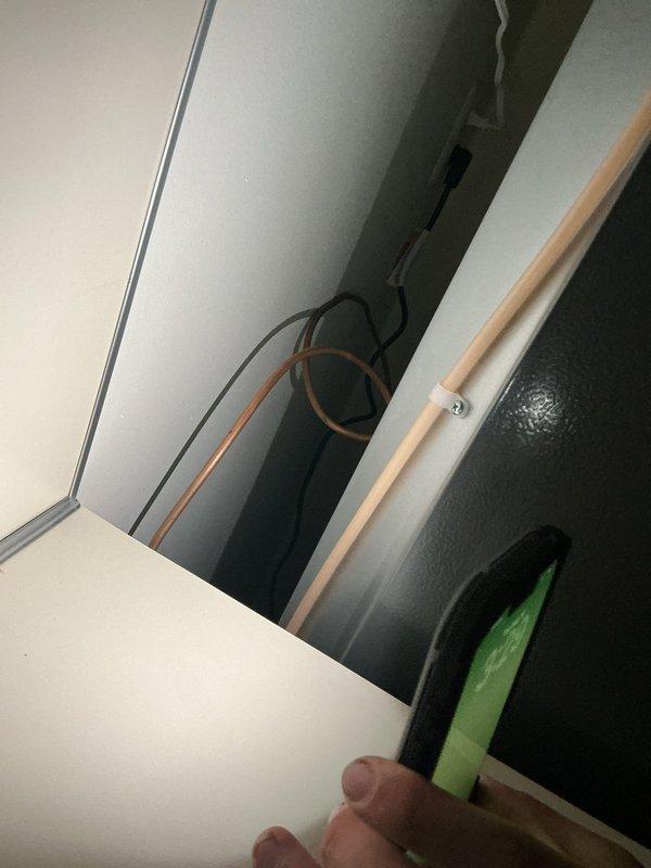 Installed new copper water supply line for refrigerator, routing from existing plumbing system through attic space to kitchen location. Connected line using brass compression fittings and secured piping to structural members with appropriate mounting brackets, ensuring proper support and code compliance throughout the installation.