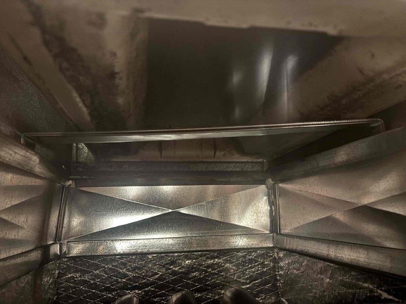 Returned to HVAC system to reposition evaporator drain pan as quoted. Successfully repositioned drain pan to proper alignment and verified secure mounting and proper drainage slope. Inspected surrounding evaporator coil components and copper refrigerant lines, noting existing corrosion on suction line from long-term moisture exposure. Confirmed drain pan now properly positioned to capture condensate and prevent overflow. System operational upon completion.