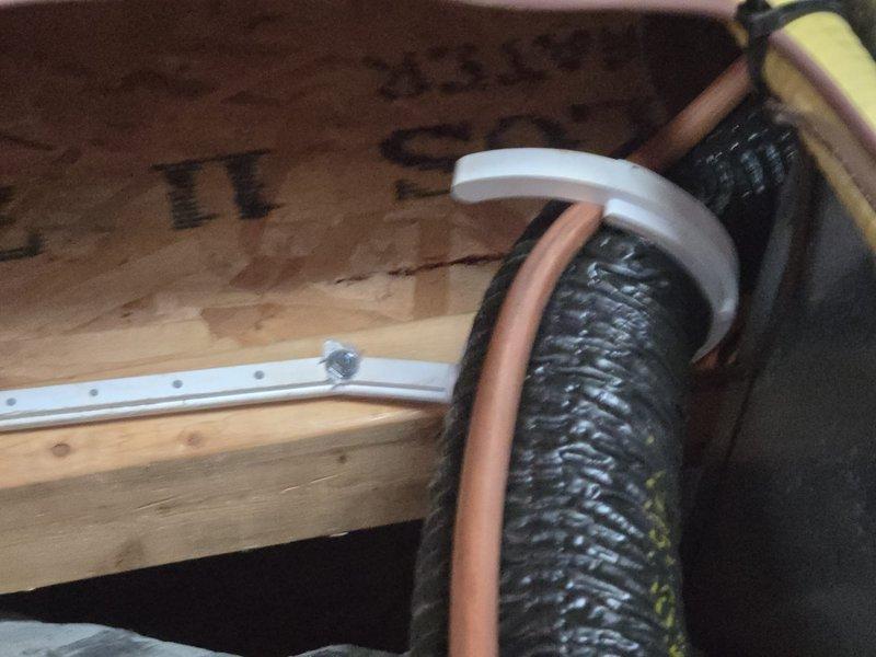 Responded to inspector correction notice by addressing four code compliance issues on HVAC installation. Provided A2L pressure testing affidavit per MMC2021 Section 1110.5 documentation requirements. Corrected dissimilar metal contact points where copper lineset made direct contact with clamp hangers and top of warm air plenum by installing appropriate isolation materials. Adjusted suction line routing and armaflex insulation to maintain proper clearance from furnace flue connector, ensuring compliance with clearance-to-combustibles requirements. Repaired and properly secured armaflex insulation on suction line where material had separated near warm air plenum, ensuring continuous coverage of copper refrigerant line throughout its run. All corrections verified to meet code specifications and documented with photographs for inspector review.