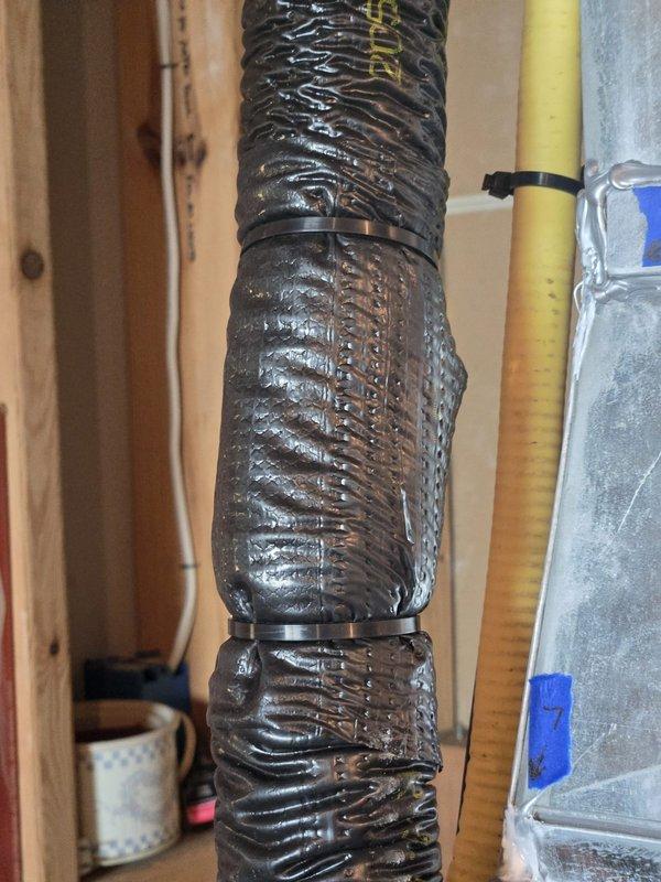 Responded to inspector correction notice by addressing four code compliance issues on HVAC installation. Provided A2L pressure testing affidavit per MMC2021 Section 1110.5 documentation requirements. Corrected dissimilar metal contact points where copper lineset made direct contact with clamp hangers and top of warm air plenum by installing appropriate isolation materials. Adjusted suction line routing and armaflex insulation to maintain proper clearance from furnace flue connector, ensuring compliance with clearance-to-combustibles requirements. Repaired and properly secured armaflex insulation on suction line where material had separated near warm air plenum, ensuring continuous coverage of copper refrigerant line throughout its run. All corrections verified to meet code specifications and documented with photographs for inspector review.