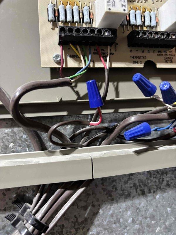 Responded to noise complaint on 9-year-old EnergiAir system installed in garage. Upon inspection, verified unit was cooling properly but operating louder than normal. Examined indoor air handler, ductwork connections, and zone control wiring for potential sources of vibration or mechanical noise. Documented existing system configuration including thermostat zone control board and ductwork installation with photos for reference. Customer advised of findings and system continues to operate with adequate cooling performance.