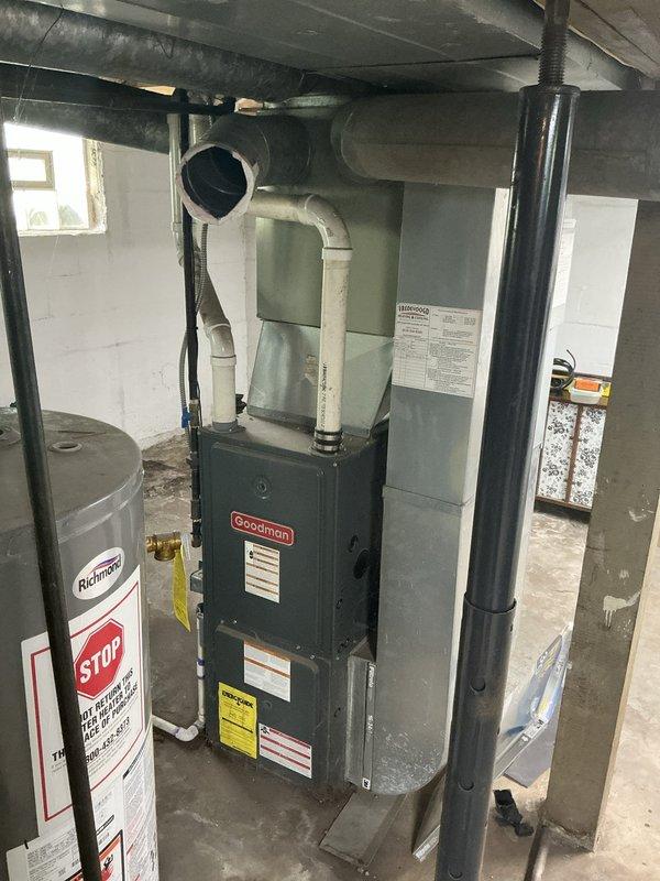 Conducted on-site assessment for whole-home HVAC system replacement in single-family residence currently equipped with 2007 Goodman furnace and window AC units. Evaluated existing basement-installed furnace, ductwork configuration, and utility space layout to provide comprehensive estimate for new furnace, central air conditioning system, and complete ductwork installation.