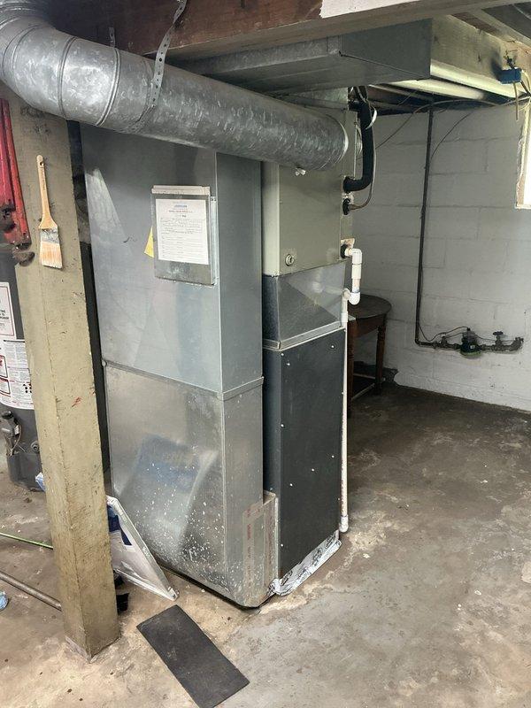 Conducted on-site assessment for whole-home HVAC system replacement in single-family residence currently equipped with 2007 Goodman furnace and window AC units. Evaluated existing basement-installed furnace, ductwork configuration, and utility space layout to provide comprehensive estimate for new furnace, central air conditioning system, and complete ductwork installation.