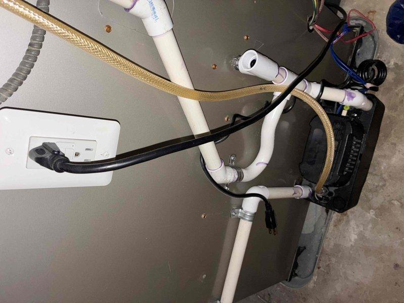 Responded to service call for HVAC unit experiencing short cycling and thermostat error following recent tune-up. Upon arrival, inspected water heater and associated mechanical systems including PVC drainage lines, condensate connections, and electrical components. Diagnosed issue with condensate pump operation affecting system cycling. Verified proper electrical connections, tested pump functionality, and ensured drainage lines were clear and properly configured. Reset system controls, cleared thermostat error code, and confirmed unit returned to normal operation without repeated start/stop cycling. System tested and left in proper working condition under existing warranty coverage.