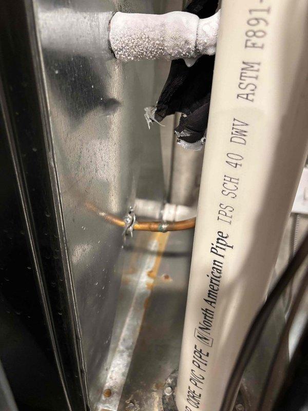# Annual Cooling Maintenance - 12-Year-Old Ruud System

Completed annual cooling maintenance on a 12-year-old Ruud air conditioning system. Upon inspection, discovered significant frost and ice buildup on the refrigerant suction line and associated copper piping within the air handler cabinet, indicating a potential system issue beyond normal maintenance scope.

## Findings and Actions

**Primary Issue Identified:**
- Heavy frost accumulation observed on suction line refrigerant piping
- Ice buildup extending along horizontal and diagonal copper lines
- Condensation present on cabinet interior surfaces
- Black insulation sleeve showing frost penetration

**Possible Causes:**
- Low refrigerant charge
- Restricted airflow across evaporator coil
- Dirty air filter or blocked return air
- Faulty metering device or expansion valve
- Evaporator coil restriction

**Maintenance Performed:**
- Visual inspection of all accessible system components
- Documented frost conditions with photographs
-