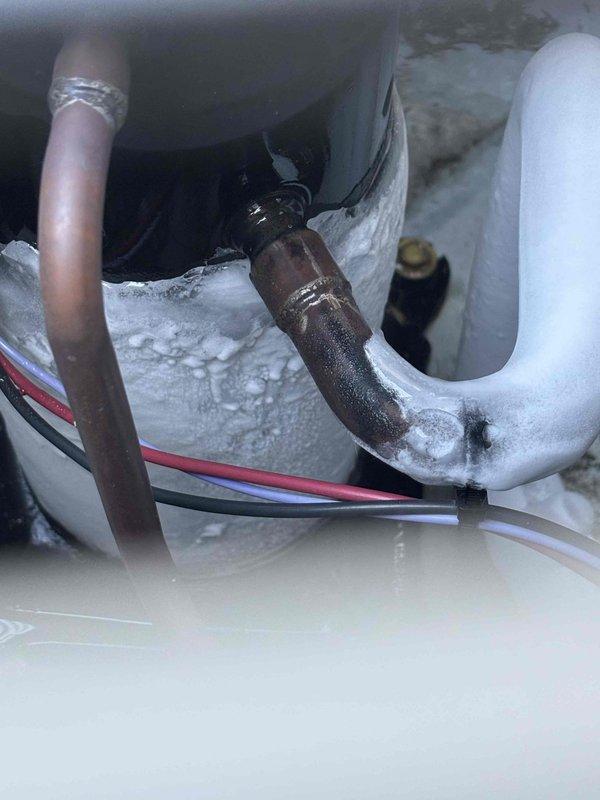 # Annual Cooling Maintenance - 12-Year-Old Ruud System

Completed annual cooling maintenance on a 12-year-old Ruud air conditioning system. Upon inspection, discovered significant frost and ice buildup on the refrigerant suction line and associated copper piping within the air handler cabinet, indicating a potential system issue beyond normal maintenance scope.

## Findings and Actions

**Primary Issue Identified:**
- Heavy frost accumulation observed on suction line refrigerant piping
- Ice buildup extending along horizontal and diagonal copper lines
- Condensation present on cabinet interior surfaces
- Black insulation sleeve showing frost penetration

**Possible Causes:**
- Low refrigerant charge
- Restricted airflow across evaporator coil
- Dirty air filter or blocked return air
- Faulty metering device or expansion valve
- Evaporator coil restriction

**Maintenance Performed:**
- Visual inspection of all accessible system components
- Documented frost conditions with photographs
-