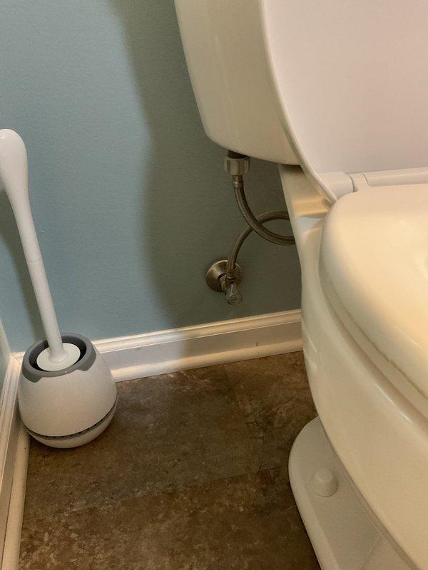 Removed existing toilet from master bathroom and installed customer-supplied replacement unit in single-family residence. Connected new water supply line from wall-mounted shut-off valve to toilet tank fill valve, ensured proper seal at floor flange, and verified functionality with no leaks detected. Installation completed in bathroom with accessibility grab bar present; all components functioning properly upon completion.