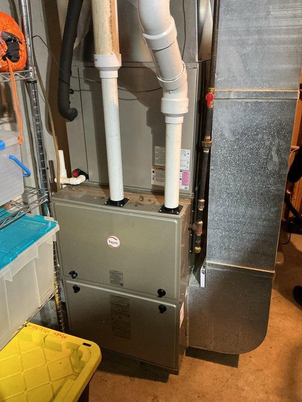 Completed annual cooling maintenance on 10-year-old Rheem AC system. Performed comprehensive tune-up including inspection of all major components, verified refrigerant levels, cleaned condenser coils, checked electrical connections, tested thermostat operation, and confirmed proper system cycling. Documented equipment condition with photos of furnace and basement mechanical area showing proper installation and venting configuration. All systems operating within manufacturer specifications with no issues identified.
