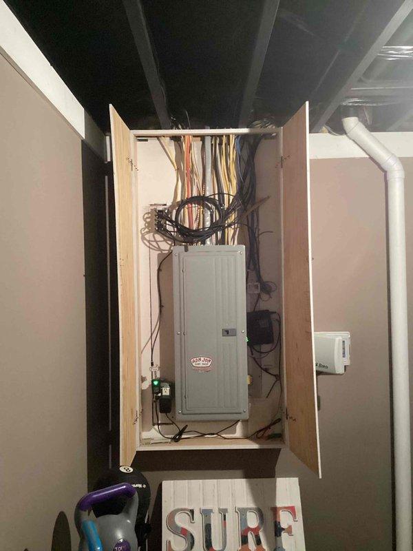 Completed estimate visit for new Generac automatic standby generator installation at 15-year-old single-family residence. Evaluated existing electrical service panel configuration and available space for generator transfer switch integration. Documented current 200-amp main electrical panel with adequate breaker capacity and determined optimal equipment placement for proposed generator system.