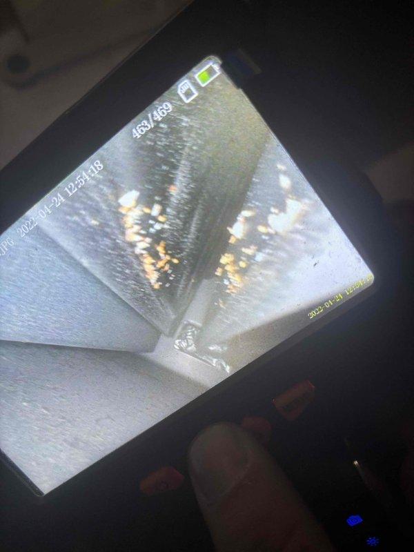 Responded to no cooling call on 20-year-old residential AC system. Upon inspection, discovered significant moisture damage and microbial growth inside ductwork, as documented with inspection camera. Assessed outdoor condenser units showing age-related wear and weathering. Identified compromised duct integrity as primary concern affecting system performance and indoor air quality.