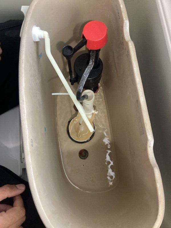 Responded to continuous running toilet issue affecting two bathrooms in 25-year-old home. Inspected both toilet tanks, identified worn flappers and fill valve components causing constant water flow. Replaced defective flappers and adjusted fill valves to restore proper shut-off function, eliminating water waste in both units.