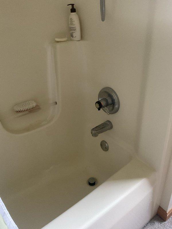 Returned to property to complete installation of customer-supplied shower cartridge and bathtub faucet in bathroom. Successfully installed new single-handle shower valve control and chrome tub spout, ensuring proper fit and function within existing fiberglass tub/shower surround. Tested water flow and temperature control to verify leak-free operation and proper cartridge performance.