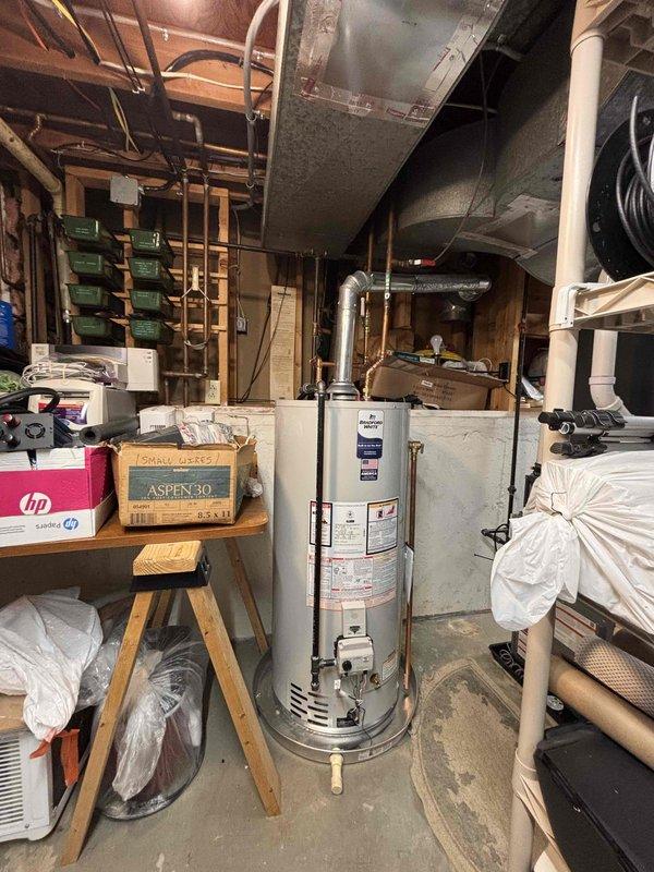 Completed full HVAC system replacement including installation of new furnace with air handler, air conditioning unit, and water heater in basement mechanical room. All equipment installed to manufacturer specifications with proper venting, ductwork connections, electrical hookups, and plumbing configurations. System tested and verified operational with financing paperwork processed for same-day completion.