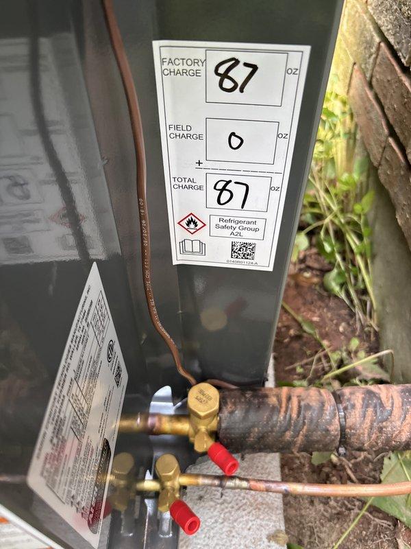 Completed full air conditioning system replacement including outdoor condensing unit and associated refrigerant line connections. New unit was installed on existing concrete pad, charged to manufacturer specifications with 87 oz total refrigerant charge (A2L safety group refrigerant). All electrical connections, refrigerant lines, and service ports were properly installed and tested. System was commissioned and verified operational with indoor air handler unit. Financing paperwork was processed and activated same day as installation.
