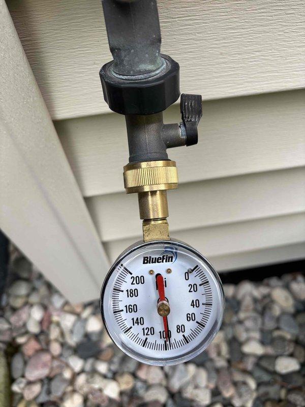 Completed annual cooling maintenance on 21-year-old Carrier system with condenser model year 2022. Performed comprehensive tune-up including system inspection, refrigerant pressure verification using BlueFin gauge assembly at exterior unit, and inspection of interior ductwork and attic-mounted air handler components. All systems operating within normal parameters; no repairs required at this time.
