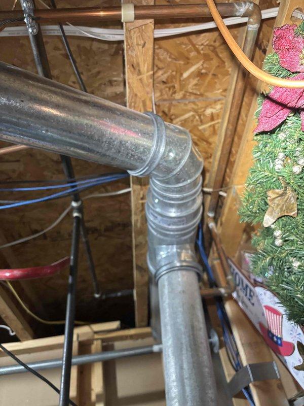 Completed annual cooling maintenance on 21-year-old Carrier system with condenser model year 2022. Performed comprehensive tune-up including system inspection, refrigerant pressure verification using BlueFin gauge assembly at exterior unit, and inspection of interior ductwork and attic-mounted air handler components. All systems operating within normal parameters; no repairs required at this time.