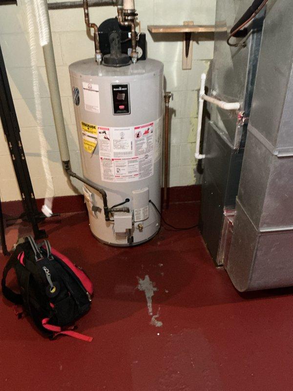 Responded to emergency call for water heater making loud rattling noise described as sounding like racks rolling around inside the unit. Upon arrival, inspected approximately 10-year-old Bradford White residential water heater. Assessed unit condition and determined noise was indicative of sediment buildup and potential tank deterioration consistent with age of equipment. Documented existing installation including copper supply lines, expansion tank, and circulator pump configuration. Photographed unit showing water staining on floor near base, indicating possible minor leakage. Given age of unit and severity of symptoms, recommended replacement rather than repair due to imminent failure risk and cost-effectiveness.