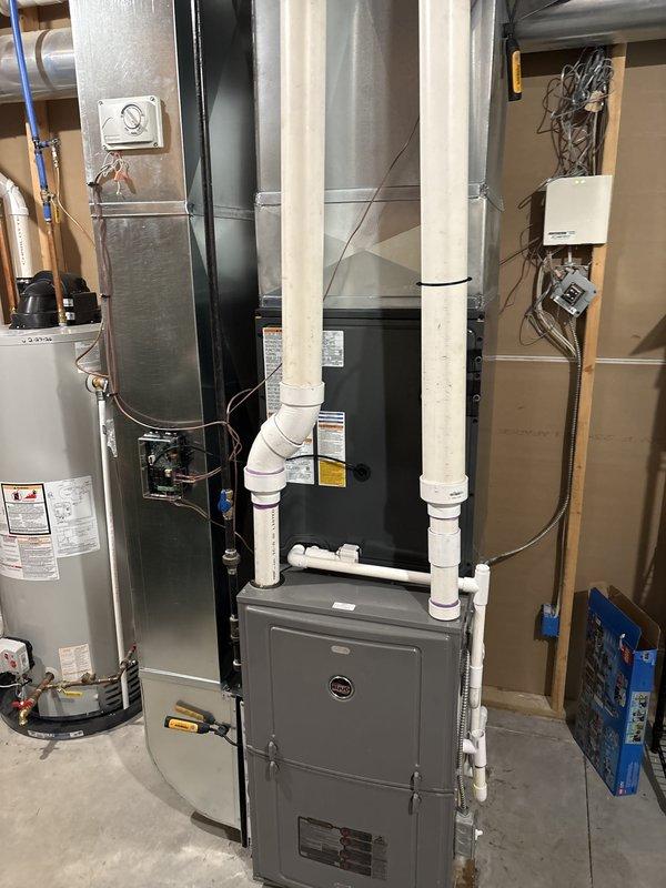 Completed full residential air conditioning system replacement. Installed new outdoor condensing unit on existing concrete pad with proper refrigerant line connections and electrical disconnect. Replaced indoor air handler with associated ductwork connections and PVC condensate drainage system. Verified all electrical connections, tested system operation, and confirmed proper cooling performance upon startup.