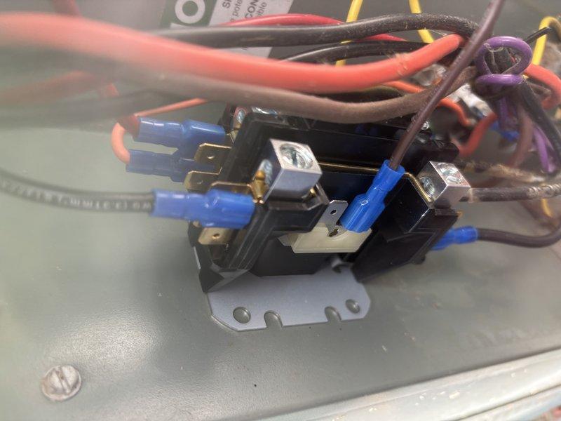 Completed annual cooling maintenance on 14-year-old Rheem air conditioning system with condenser model year 2020. Performed standard tune-up procedures including inspection of electrical components, relay assembly, and wiring connections as documented in service photos.