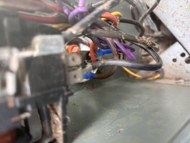 Completed annual cooling maintenance on 14-year-old Rheem air conditioning system with condenser model year 2020. Performed standard tune-up procedures including inspection of electrical components, relay assembly, and wiring connections as documented in service photos.
